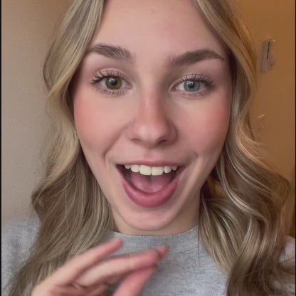 Close-up of a person's eye wearing Eyeling Amber Brown contact lenses. The contact lenses feature a unique design without a pupil opening, creating a strikingly natural eye appearance. The rich, warm brown hue blends seamlessly with the natural eye color, offering a subtle yet captivating transformation. The high-quality, handcrafted lenses from Sweden reflect a sophisticated tinting technology, enhancing the eye's beauty without compromising vision.