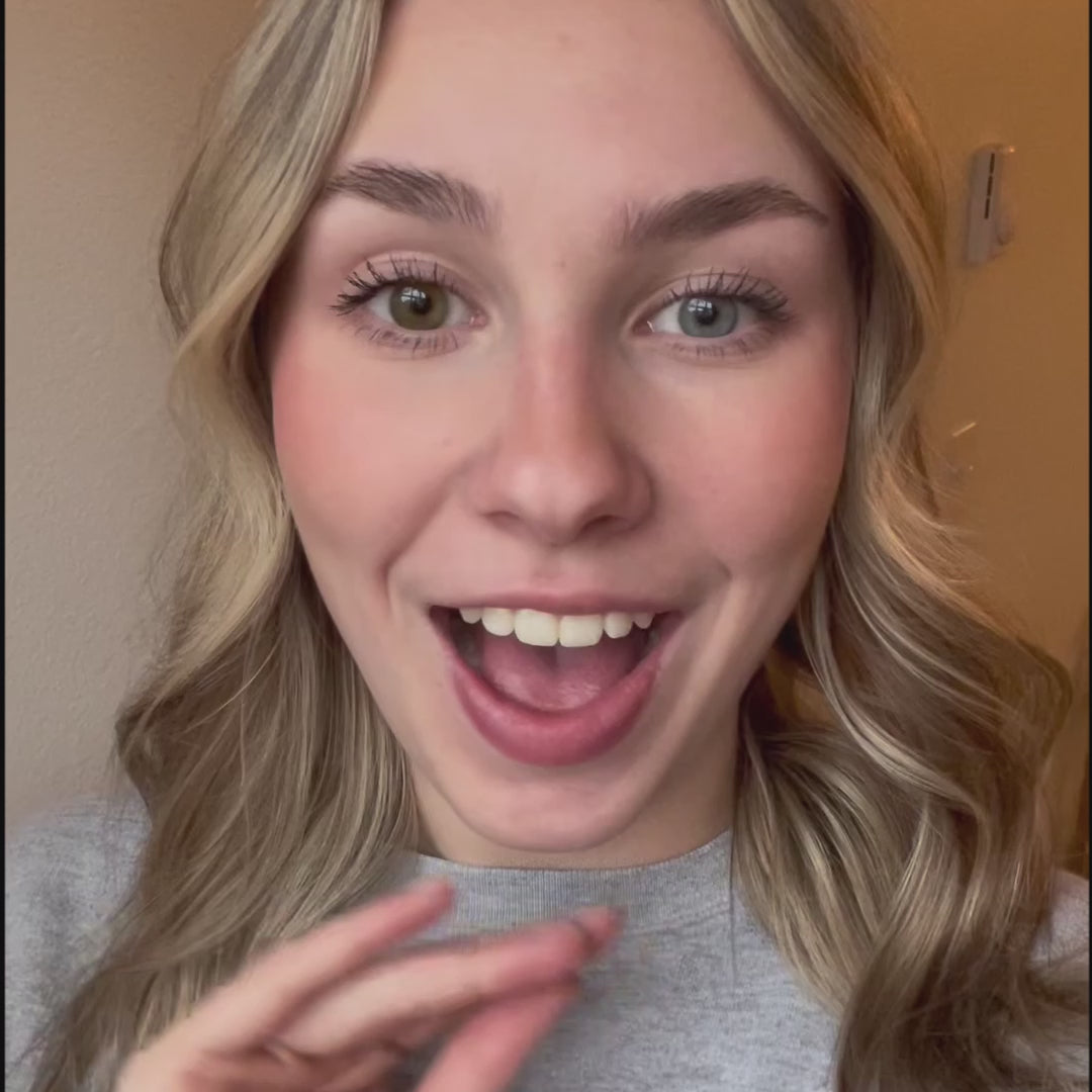 Close-up of a person's eye wearing Eyeling Amber Brown contact lenses. The contact lenses feature a unique design without a pupil opening, creating a strikingly natural eye appearance. The rich, warm brown hue blends seamlessly with the natural eye color, offering a subtle yet captivating transformation. The high-quality, handcrafted lenses from Sweden reflect a sophisticated tinting technology, enhancing the eye's beauty without compromising vision.